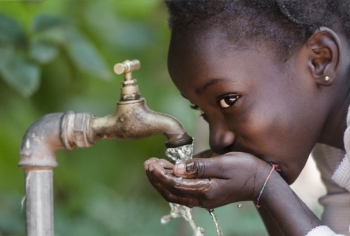 young-girl-drinking-water-from-faucet-outdoor-horizontal-606x410-image-file